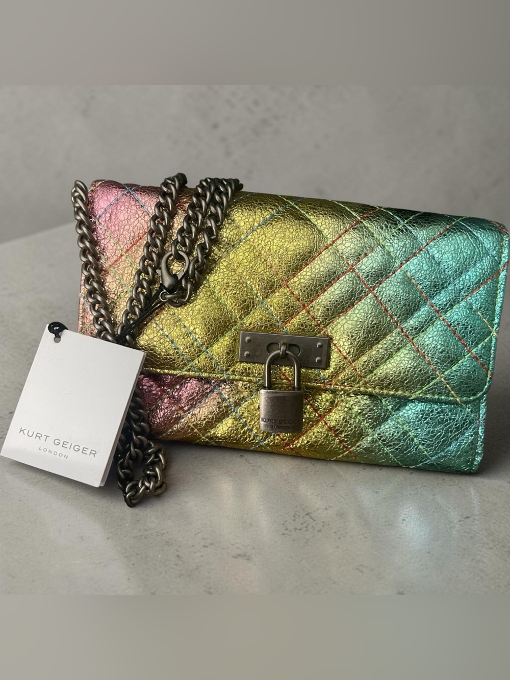 Kurt Geiger, Brixton bag featuring a rainbow iridescent metallic quilted leather